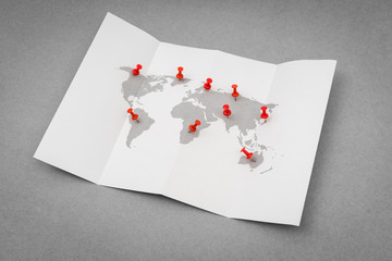 Obraz premium Paper folded world map with red Pin Pointer .