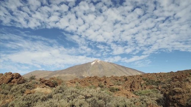 Footage of dramatic volcanic landscape with majetic Teide volcano in a background, Tenerife, Canary Islands, Spain.