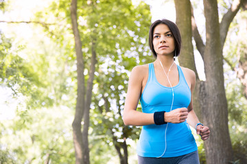 Fototapeta premium Sporty young woman running outdoors