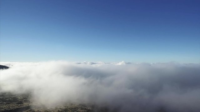 Panoramic footage of low clouds surrounding Mount Teide Volcano, Tenerife, Canary Islands, Spain.