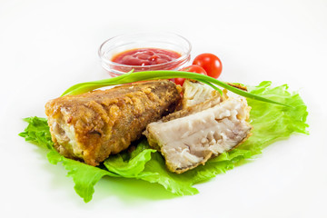 fried hake with tomatoes and green onion