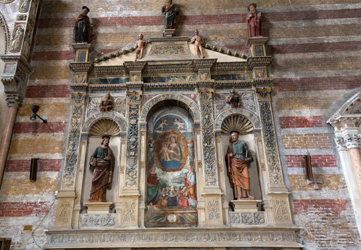  The Madonna with the child by Bonino da Campione in the church of The Eremitani (Chiesa degli Eremitani) on the tomb of Umberto da Carrara. Padua. Italy