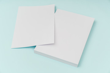 Blank flyer poster, brochure mockup,A4, US-Letter, on blue backg