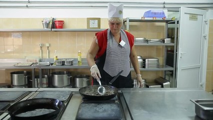 The process of cooking in the dining room.