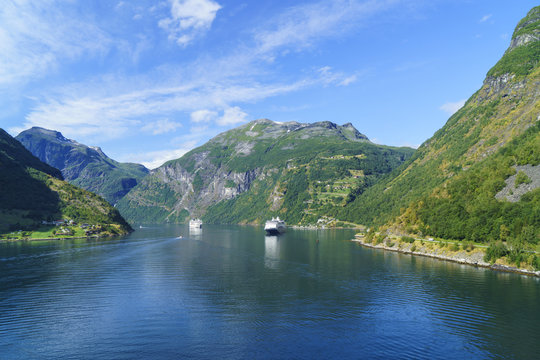 Cruiseships moored at the head of Geirangerfjord by the village of Geiranger