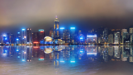 Hong Kong foggy night on Victoria's harbour from Tsim Sha Tsui waterfront