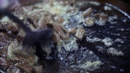 The process of cooking in the dining room.