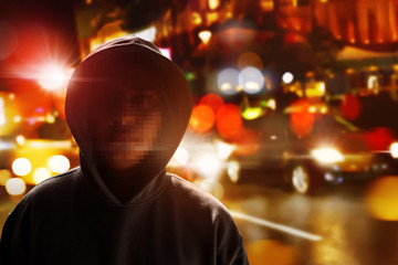 Hacker anonymous on the street at night