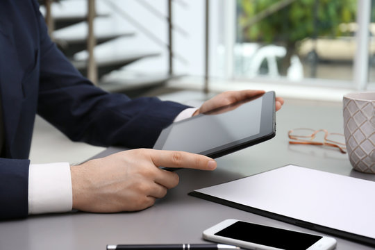 Businessman with tablet in office