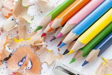 Sharpened colorful pencils and wood shavings
