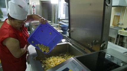 The process of cooking in the dining room.