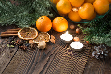 Obraz na płótnie Canvas Tangerines and decorations for the holiday table