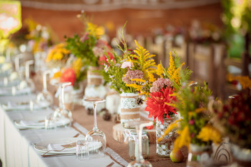 decorations made of wood and wildflowers served rustic