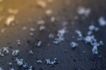 Snow close-up on a black background