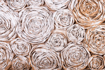 Wall with paper flowers. Handmade craft creative abstraction background.