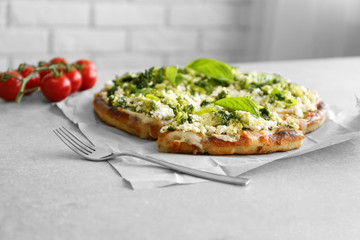 Vegetarian Italian pizza with cheese and vegetables on table