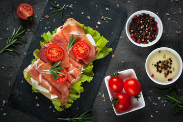 Ciabatta sandwich with  salad leaves jamon serrano mozzarella
