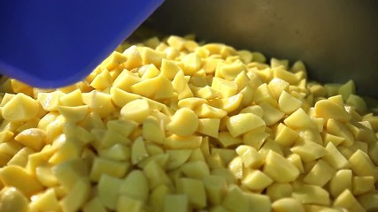 The process of cooking in the dining room.