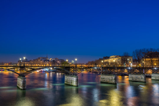 Pont des arts Bridge by the Seine river iin Paris at night