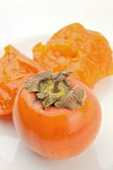 Fresh ripe persimmons isolated on white background