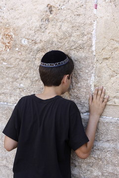 Boy praying at the Western Wall, Jerusalem, Israel