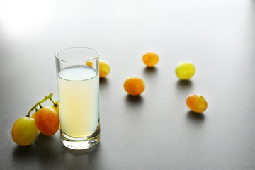 Shot with grape berries on gray background