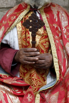 Coptic Orthodox priest holding a cross, Addis Ababa, Ethiopia