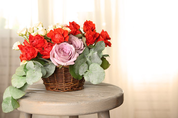 Beautiful flowers on wooden chair