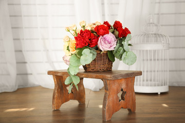 Beautiful flowers on wooden chair