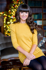 young beautyful woman sitting on the tabouret
