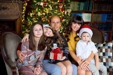 Christmas family of five people, happy parents and their kids