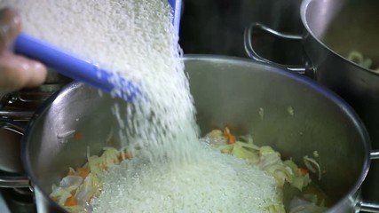 The process of cooking in the dining room.