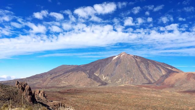 Time lapse video of famous Teide Mountain, Tenerife, Canary Islands. Dramatic clouds passing over high mountain. Pico de Teide is the highest mountain in Canary Islands - 3,718-metre (12,198 ft).