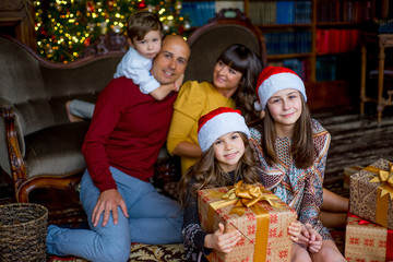 Christmas family of five people, happy parents and their kids