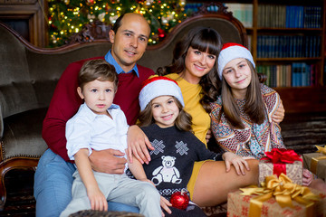 Christmas family of five people, happy parents and their kids