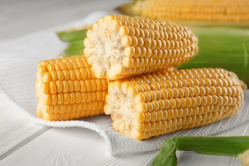 Fresh corncobs on napkin, closeup
