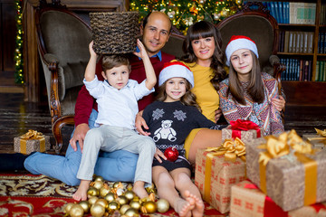 Christmas family of five people, happy parents and their kids