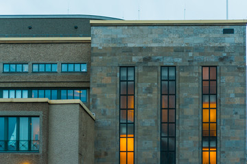 old factory building with orange lights in the inside
