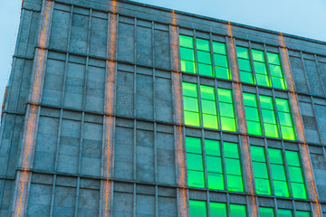 Fototapeta premium industrial building with big green colored windows