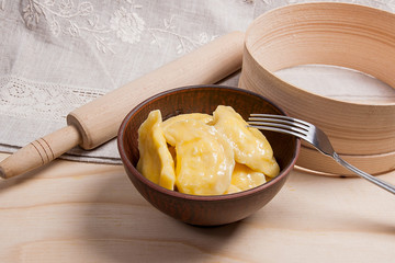 Fresh boiled varenyky or dumpling with cottage cheese or curd in