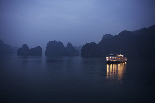 Paddle steamer at anchor, dawn, Halong bay, Vietnam