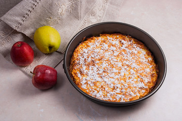 Apple pie with fresh fruits on light marble background