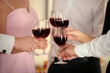 People clinking glasses at party, close up view