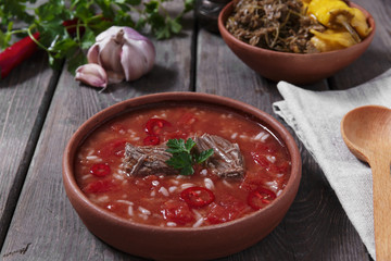 Traditional Georgian soup Kharcho with meat and rice in ceramic ware