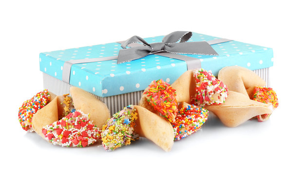 Pile of fortune cookies with sprinkles and present box isolated on white