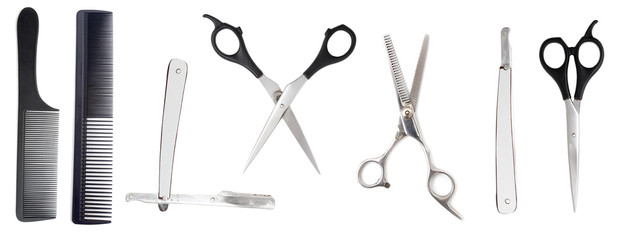 Comb with scissors and razor on a white background