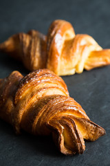 Fresh croissants on a dark background