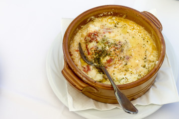 Spicy Baked Feta and Tomatoes. Traditional Greek oven dish. Soft