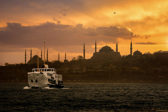 Iconic Istanbul Old Town silhouette and the ship during sunset
