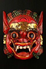 Asian traditional wooden red painted demon mask